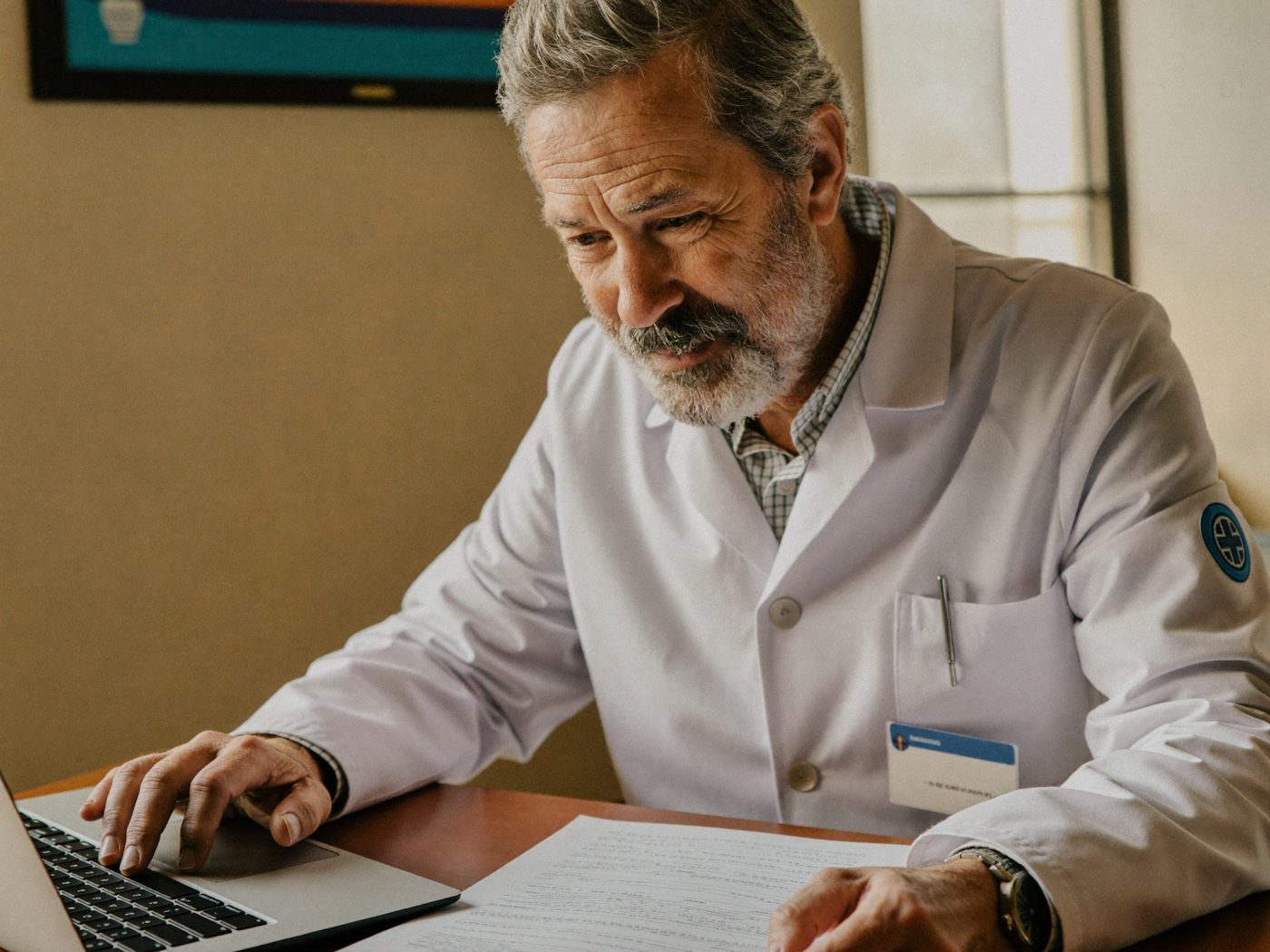 Illustrative: a clinician at a laptop