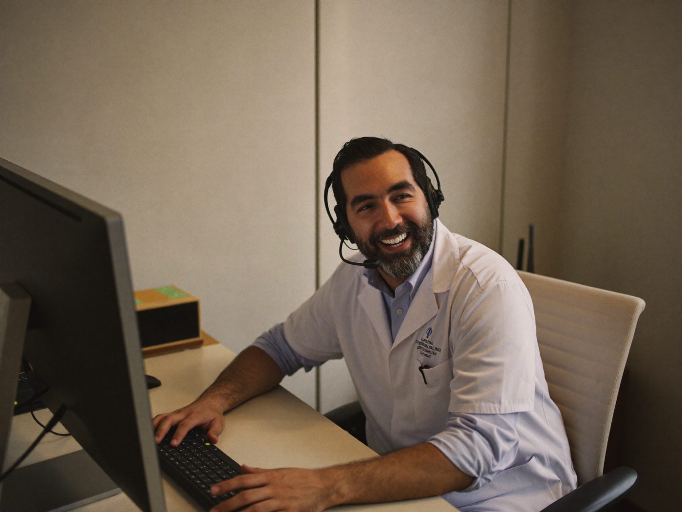 Illustrative: a support specialist on a headset